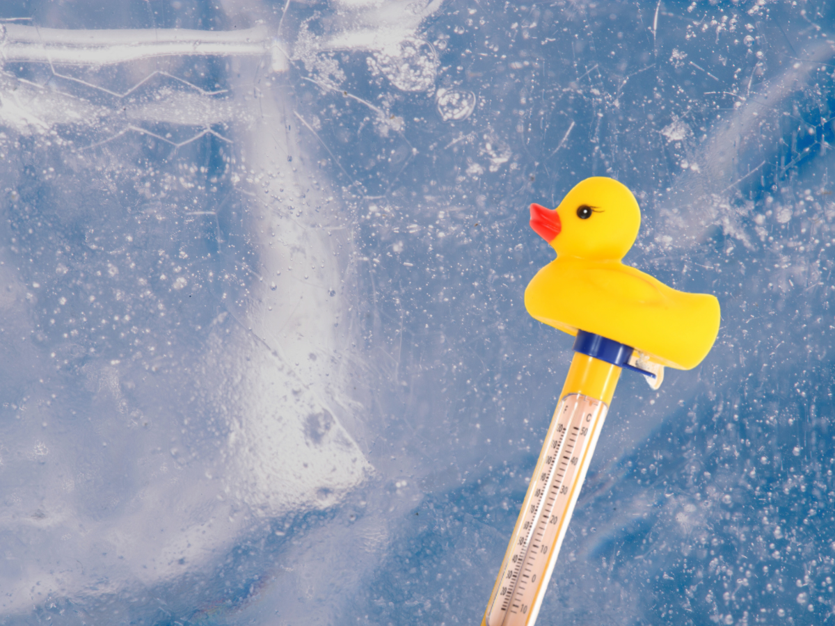 Close up of ice bath thermometer on an icy background